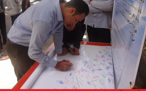 	مردم نهاوند طومار " گزاره برگ ملت ایران "در مذاکرات هسته‌ای را امضا کردند+ تصاویر 